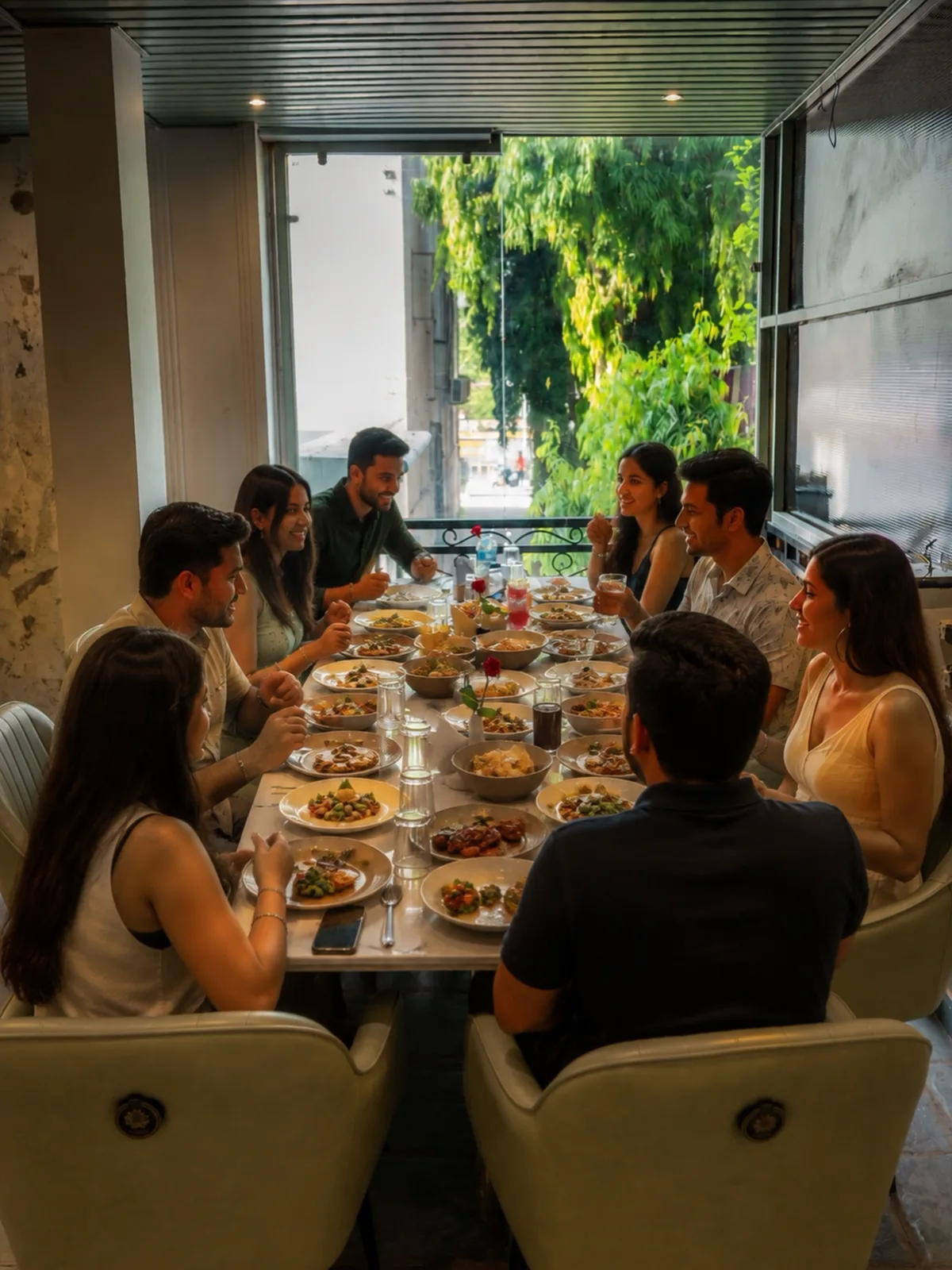 Guests enjoying a shared meal together at Vestta Restaurant